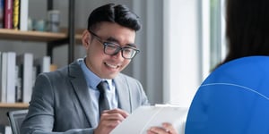 Manager signing a document