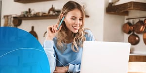 A woman thinking on her training front of the computer