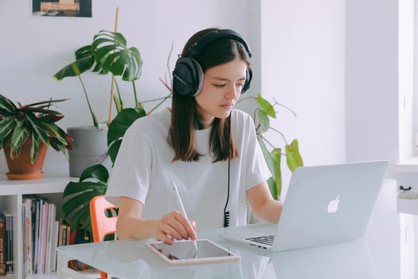 Retorio girl sitting at desk with laptop