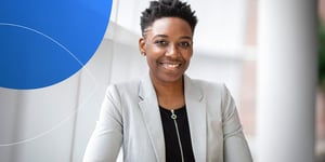 Retorio lady in a grey suit smiling 