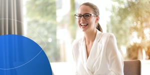 Retorio lady smiling at her desk