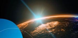 Conceptual digital art of a blue light beam rising over the Earth's horizon at sunrise.